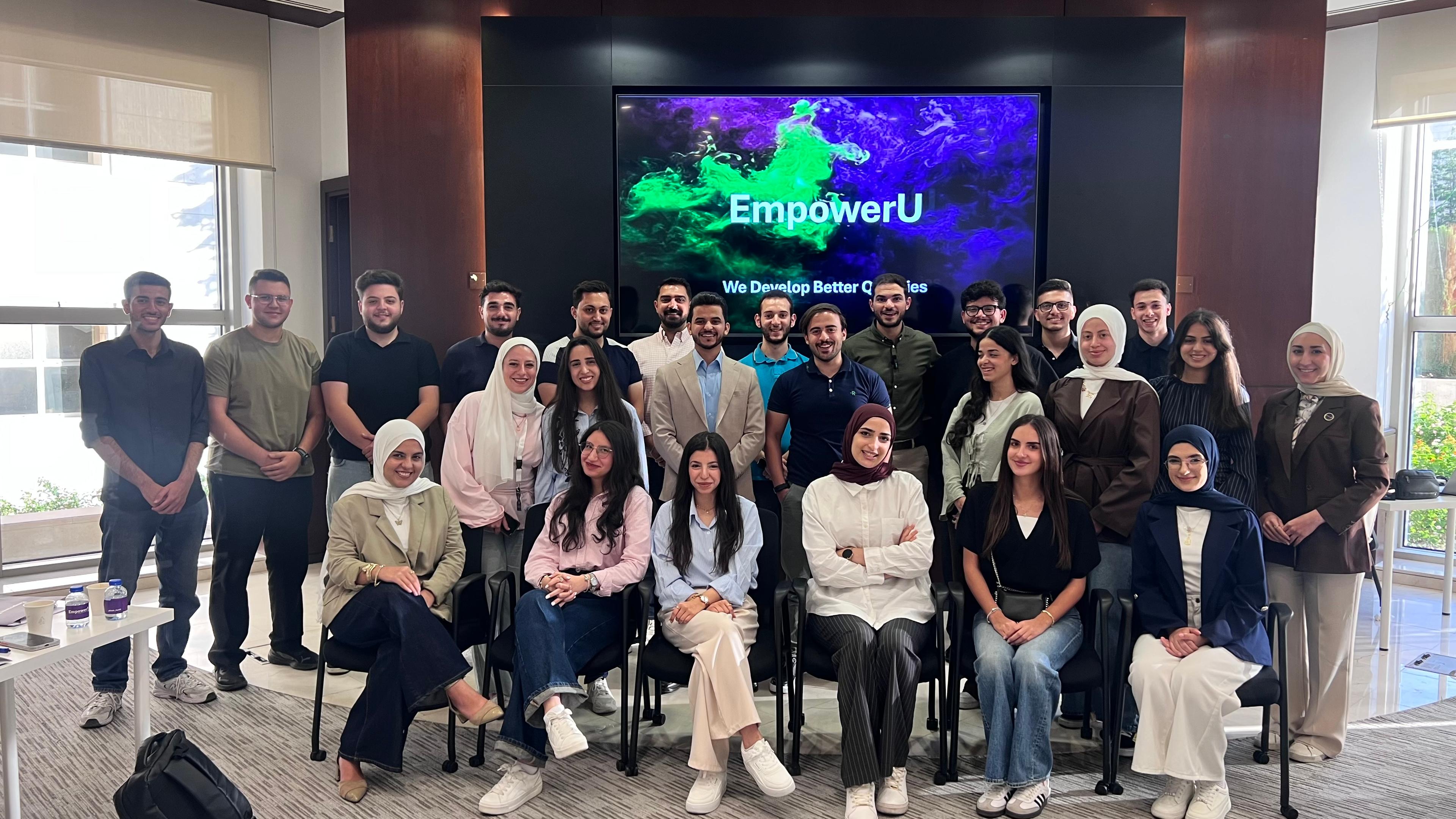 The Camp 1 cohort gathered in front of the EmpowerU screen